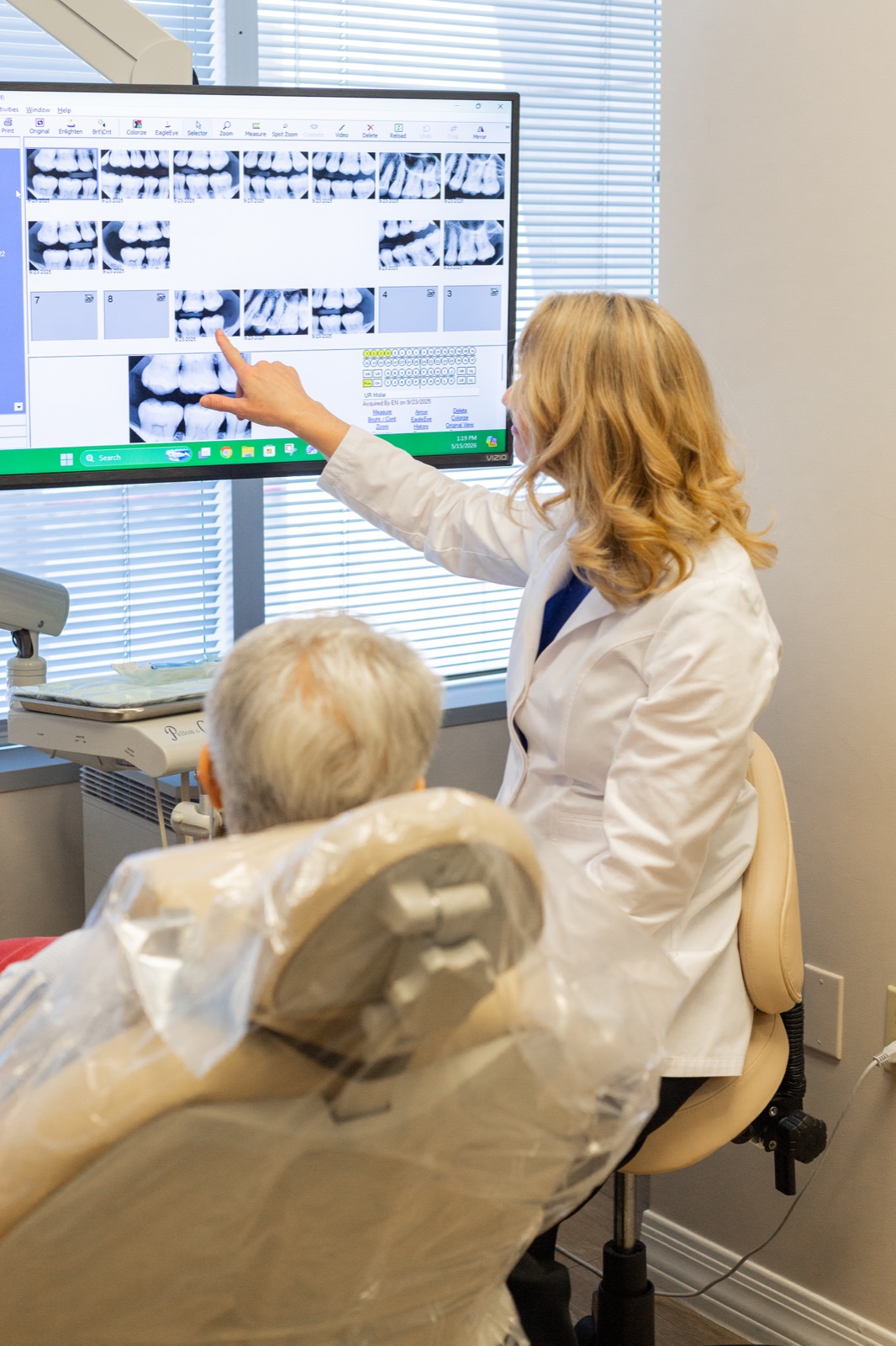 Dr. House studying a patient's imaging and prior records