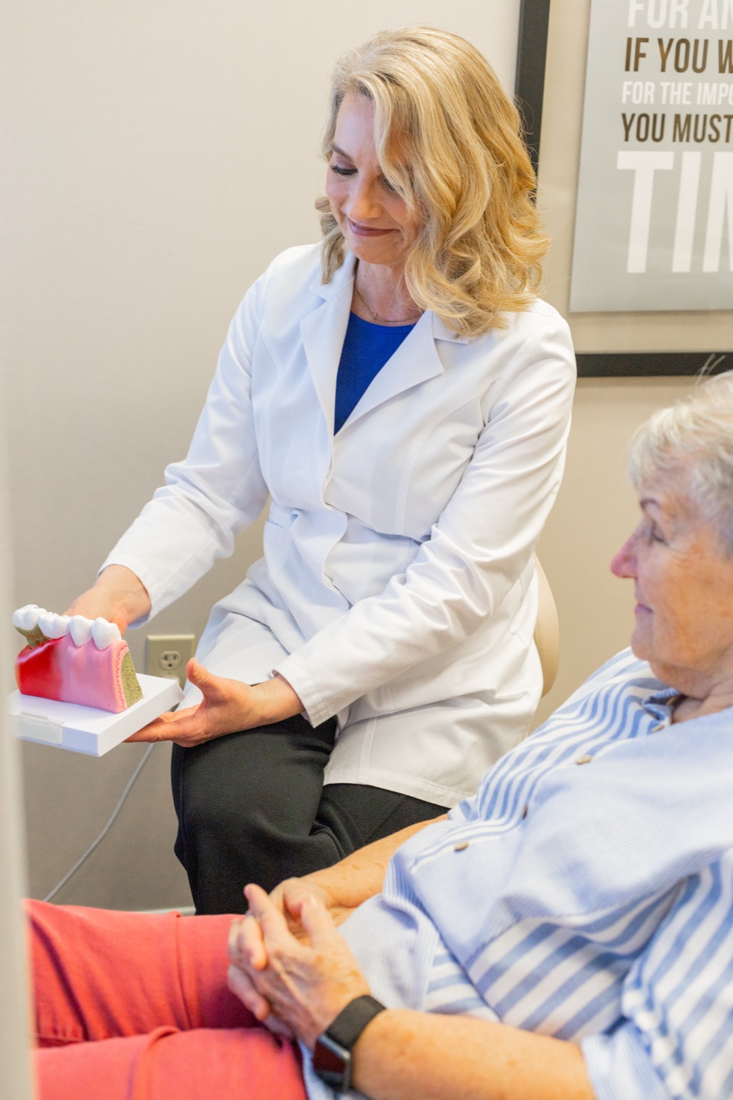 Dr. House in empathetic conversation with a patient about jaw pain