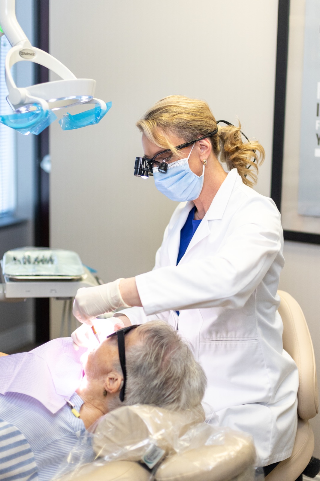 Dr. House conducting a soft-tissue oral exam at the chair