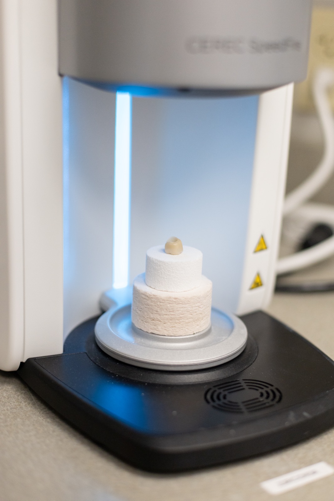 Ceramic being processed in the in-office milling unit