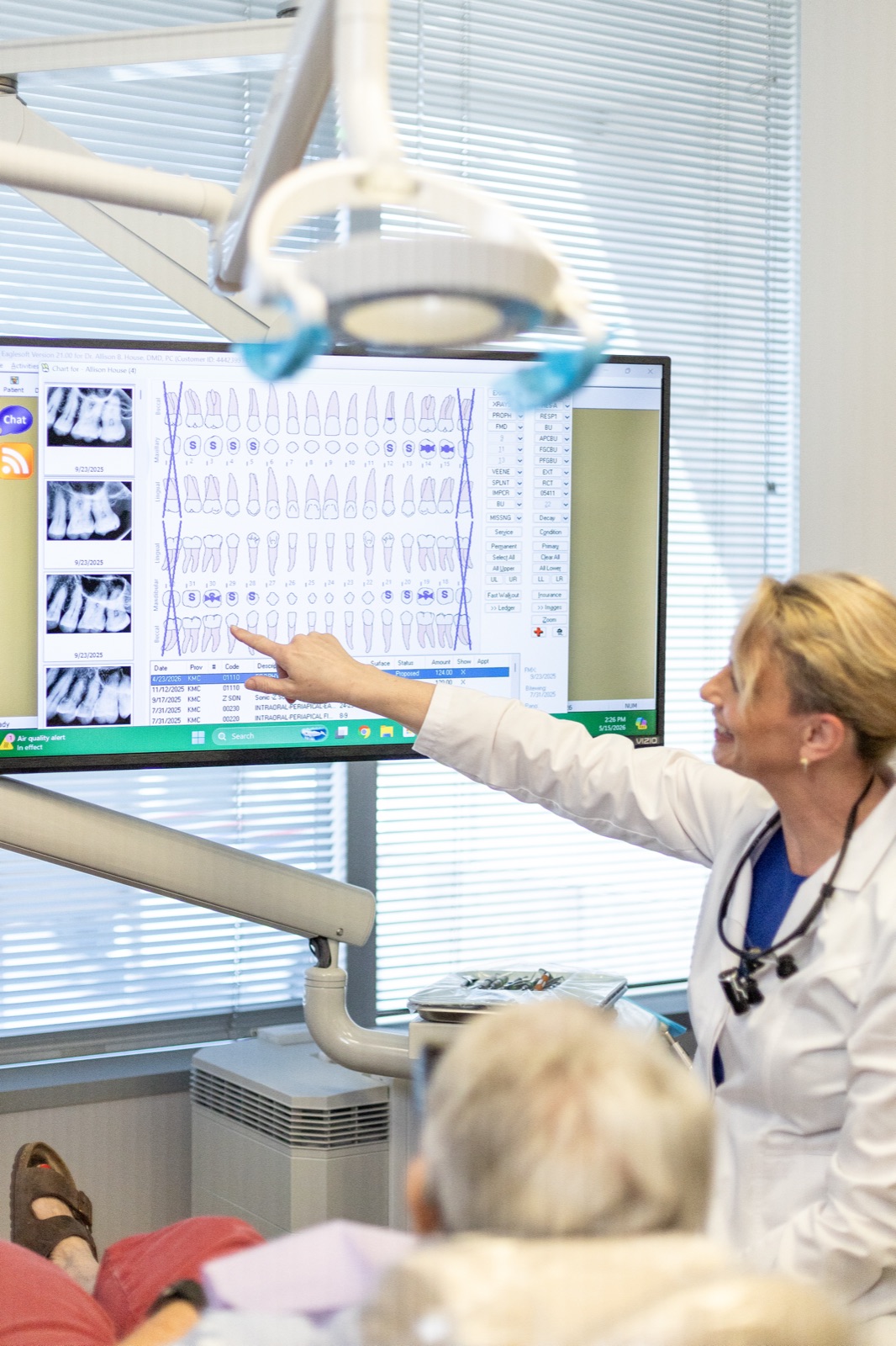 Dr. Allison House reviewing jaw imaging with a patient